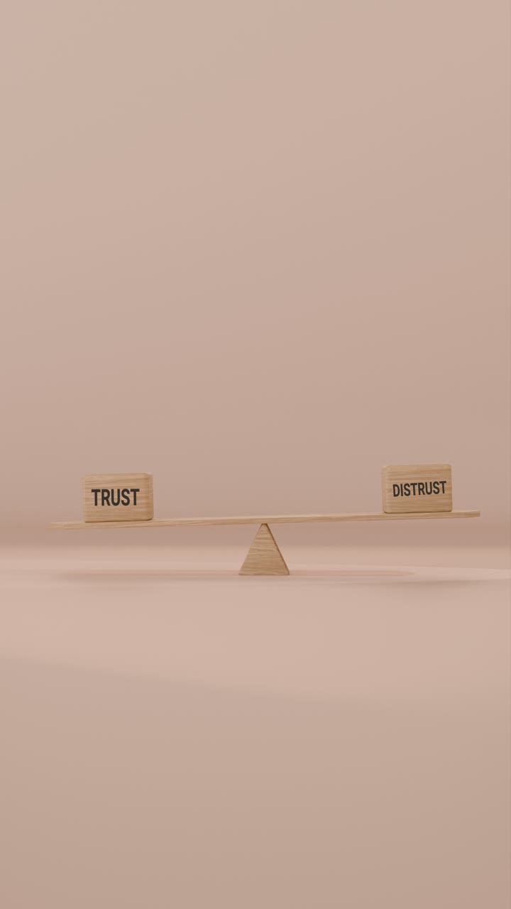 VERITCAL VIDEO OF TRUST AND DISTRUST BALANCING ON SEESAW