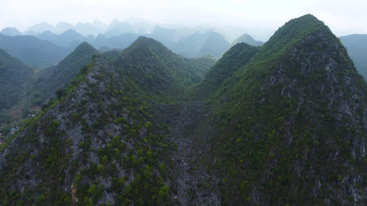 Dong Van Plateau, Vietnam with high elevated mountains covered in vegetation