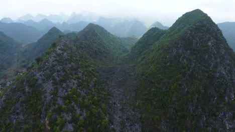 Dong-Van-Plateau,-Vietnam-with-high-elevated-mountains-covered-in-vegetation