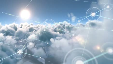 animation of network of connections with icons over sky with clouds