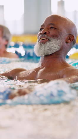 senior man swimming in a pool