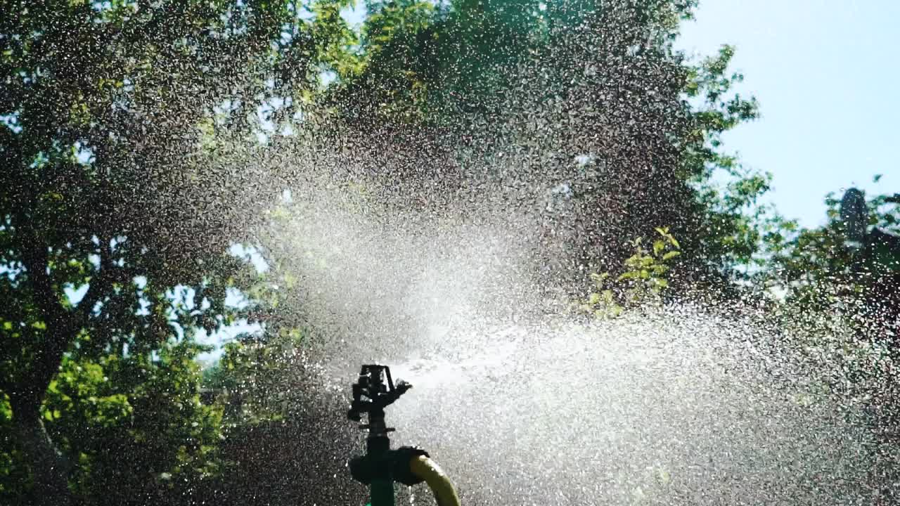 Watering garden equipment. Close up view of technique of watering in the garden