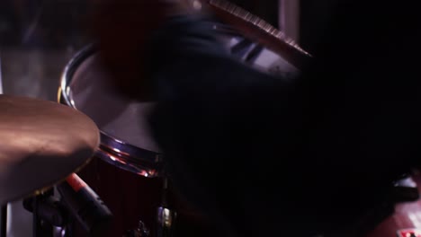 close up of a drummer playing drums