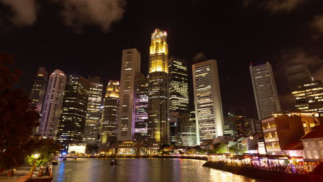 singapore - 5 march 2025 : timelapse of the singapore central business district skyline reflected in the river at night