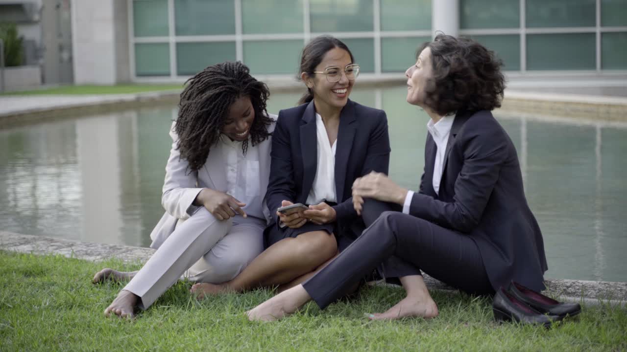 Smiling employees talking and laughing during break