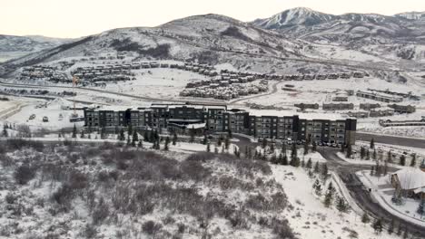 hotel resort lodge in snowy utah mountains of park city, aerial