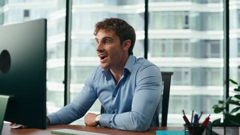 Businessman-celebrate-profit-growth-looking-at-computer-on-office-desk-close-up.