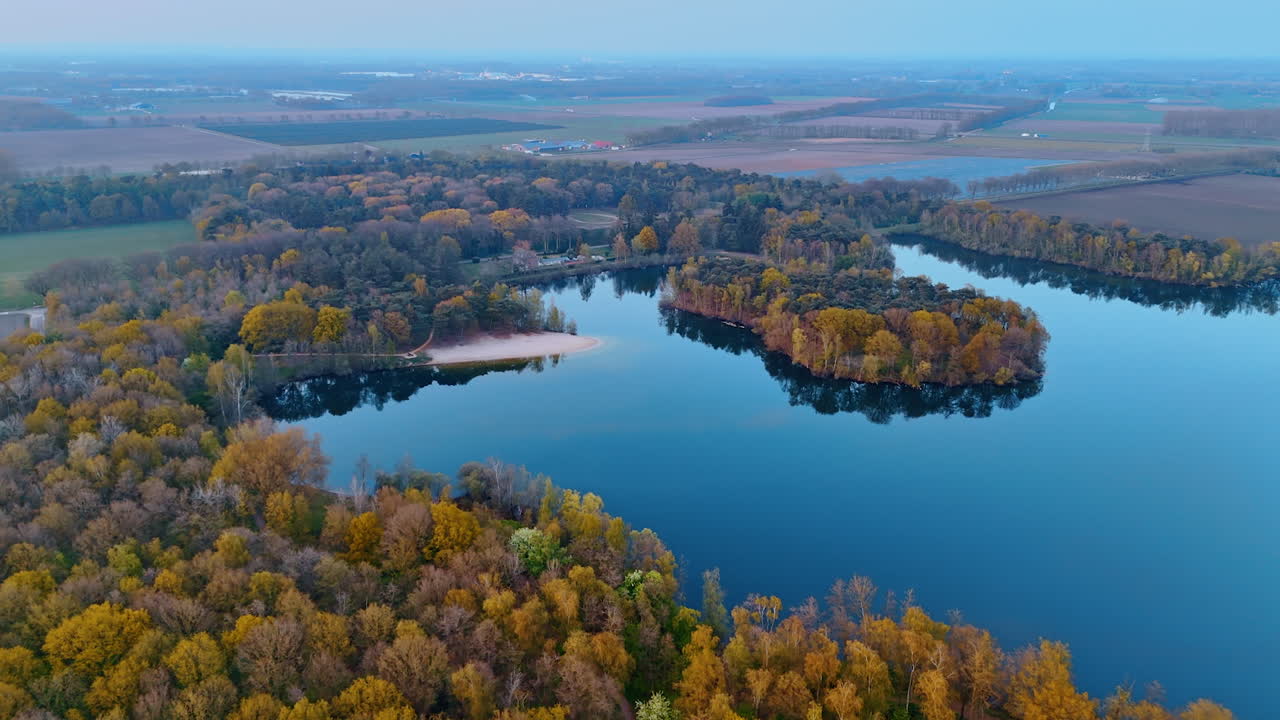 Discover Netherlands calm waters. Vibrant autumn foliage surrounds tranquil lakes in the Netherlands, capturing the peaceful essence of nature beauty