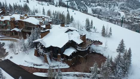 aerial drone shot of a luxurious winter getaway in the mountains of deer valley