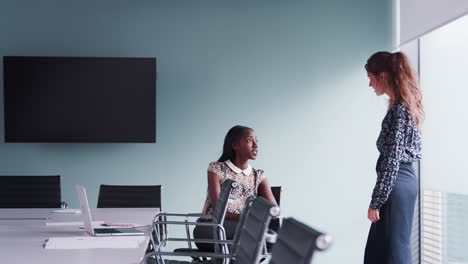 Casually-Dressed-Businesswomen-Having-Informal-Meeting-In-Modern-Boardroom-Shot-In-Slow-Motion