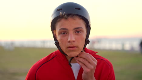 face, boy or teenager helmet in sunset nature