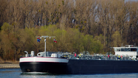 industrial transport ship sailing with gas or liquids on the rhine near karlsruhe, germany