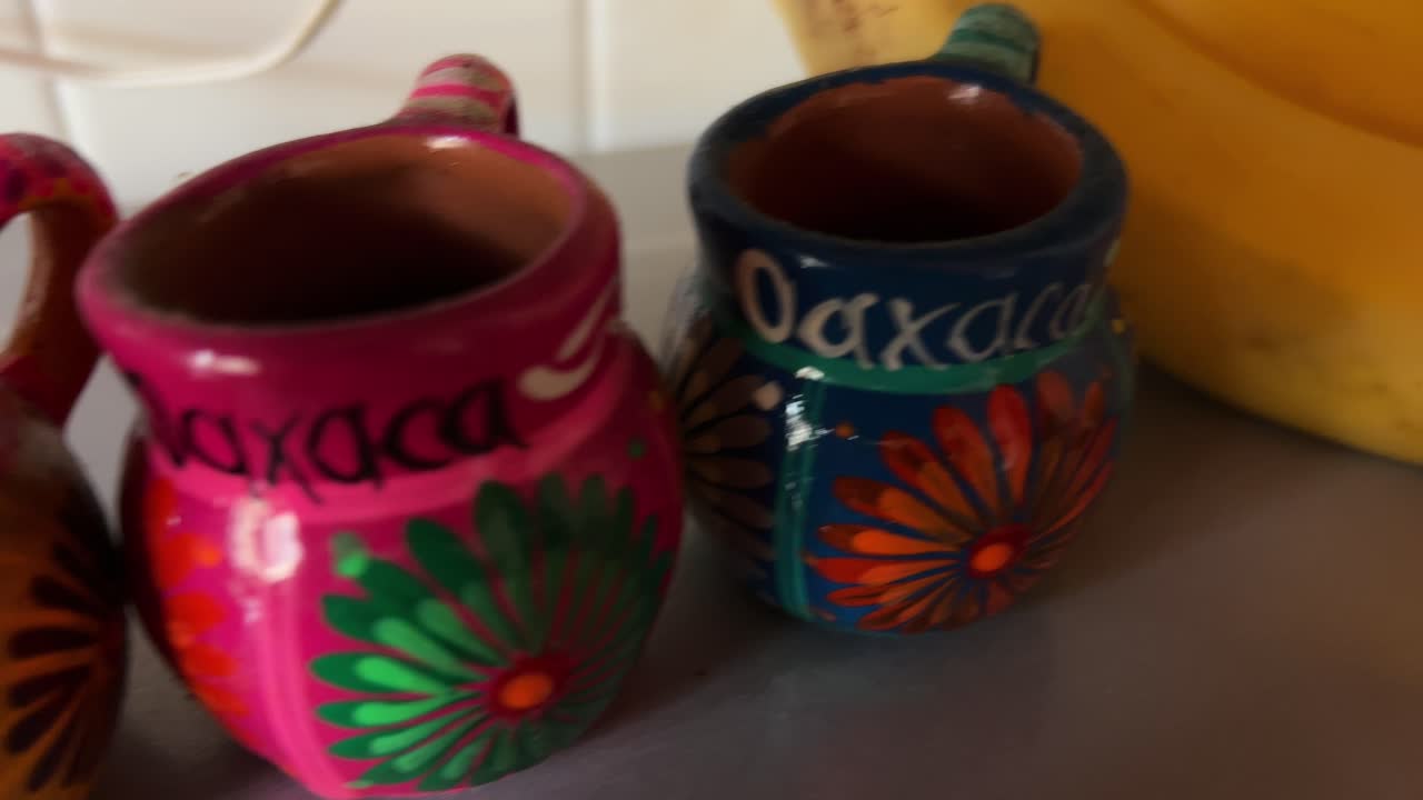 Colorful mug and bananas in kitchen, emphasizing Mexican culture, still life