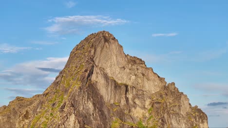 segla mountain against blue sky in senja, norway - aerial shot