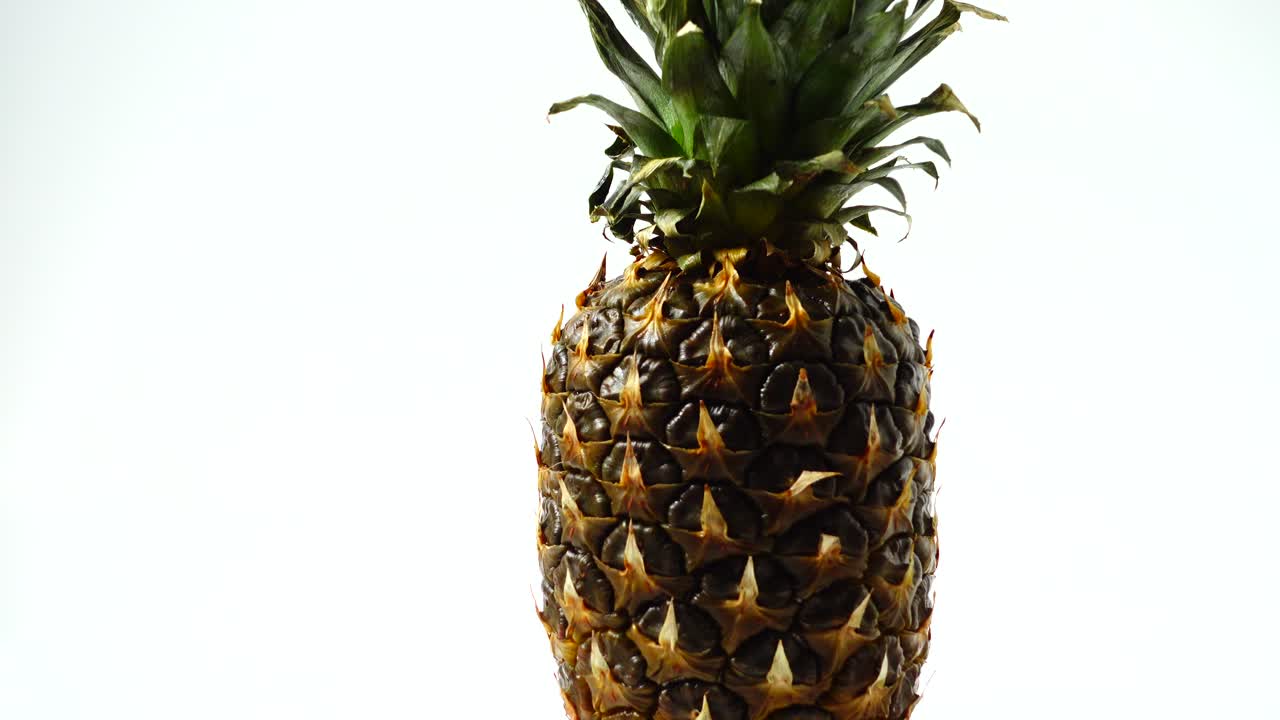 Pineapple, shooting in the movement. Healthy food