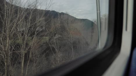 view from outside the train window in winter around creux du van, neuchatel, switzerland. travel videos in winter.