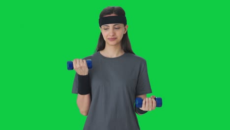 Serious-Indian-girl-lifting-dumbbells-Green-screen