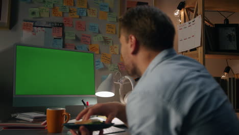cheerful freelancer waving chromakey computer closeup. eating man speaking video