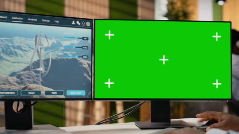 technician working on futuristic wind turbine concept on isolated screen pc