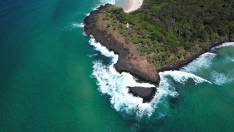 aerial view of stunning coastal scene with waves crashing on rocks