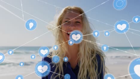 Animation-of-network-of-connections-over-happy-woman-on-the-beach