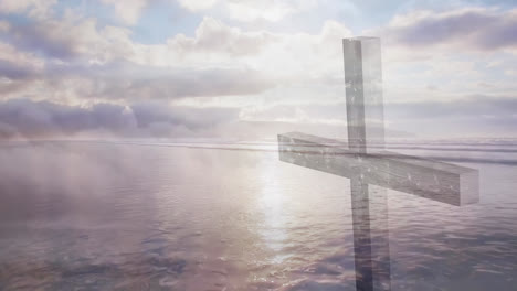 animation of a christian cross over moving clouds and the sea