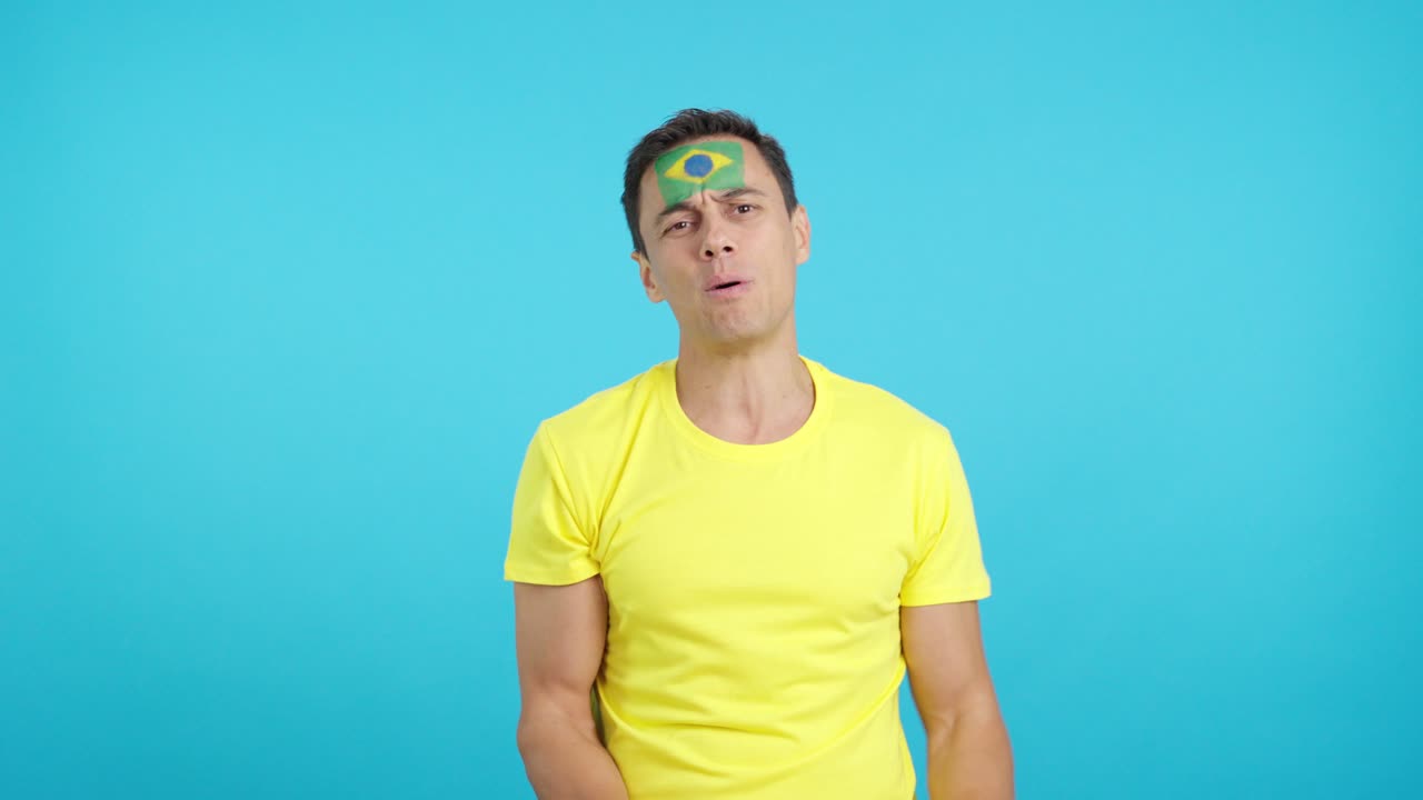 Brazilian supporter during an exciting march that is ultimately lost