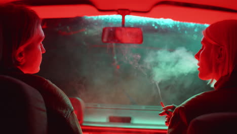 Couple-Smoking-Cigarette-in-Car