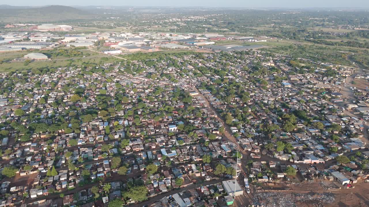 Captivating aerial clip, a bird's eye view offers a sweeping perspective over a vast rural township outside Pretoria, South Africa