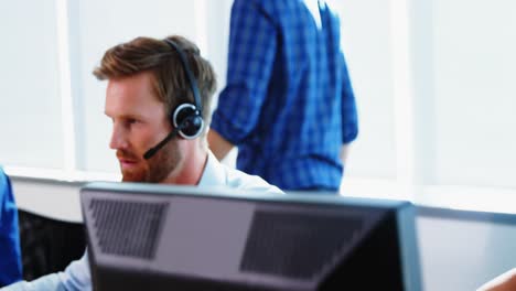 team of business executives working together at desk