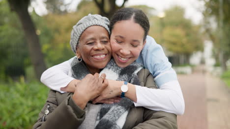 caregiver, hug and park with old woman