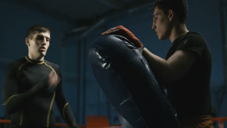 mma training session with a kick pad