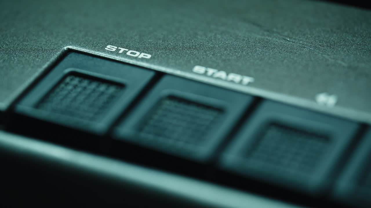 Closeup radio buttons panel in studio place. Stop start keys on tape recorder