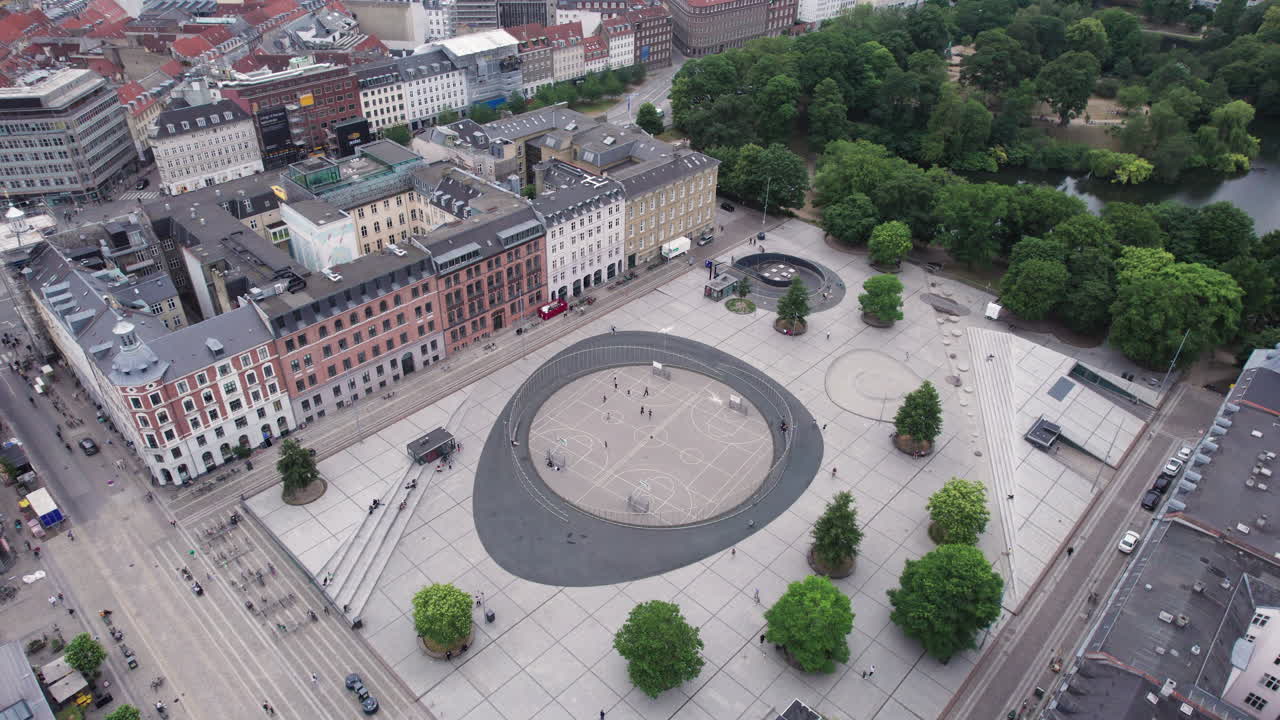Looking down from above, you'll see Israels Plads in the heart of Copenhagen buzzing with people and the energy of urban life