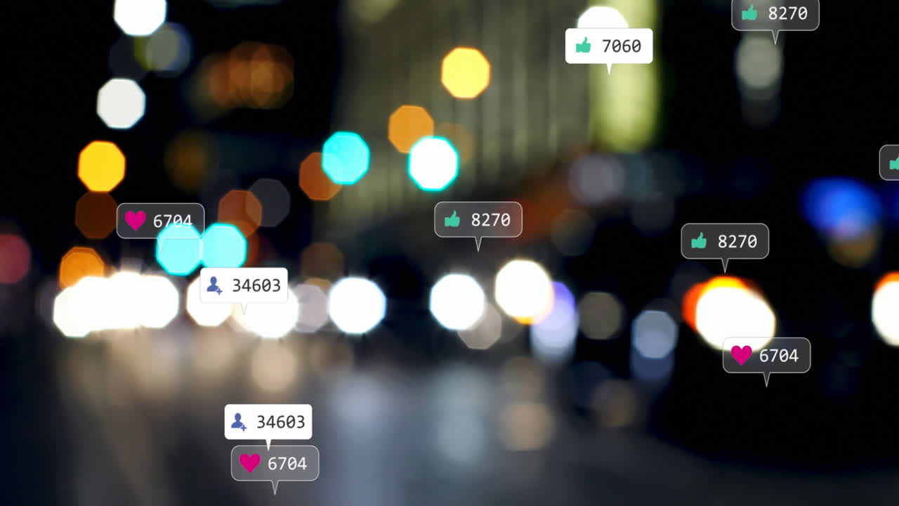 Animation of social media icons and numbers over out of focus traffic light
