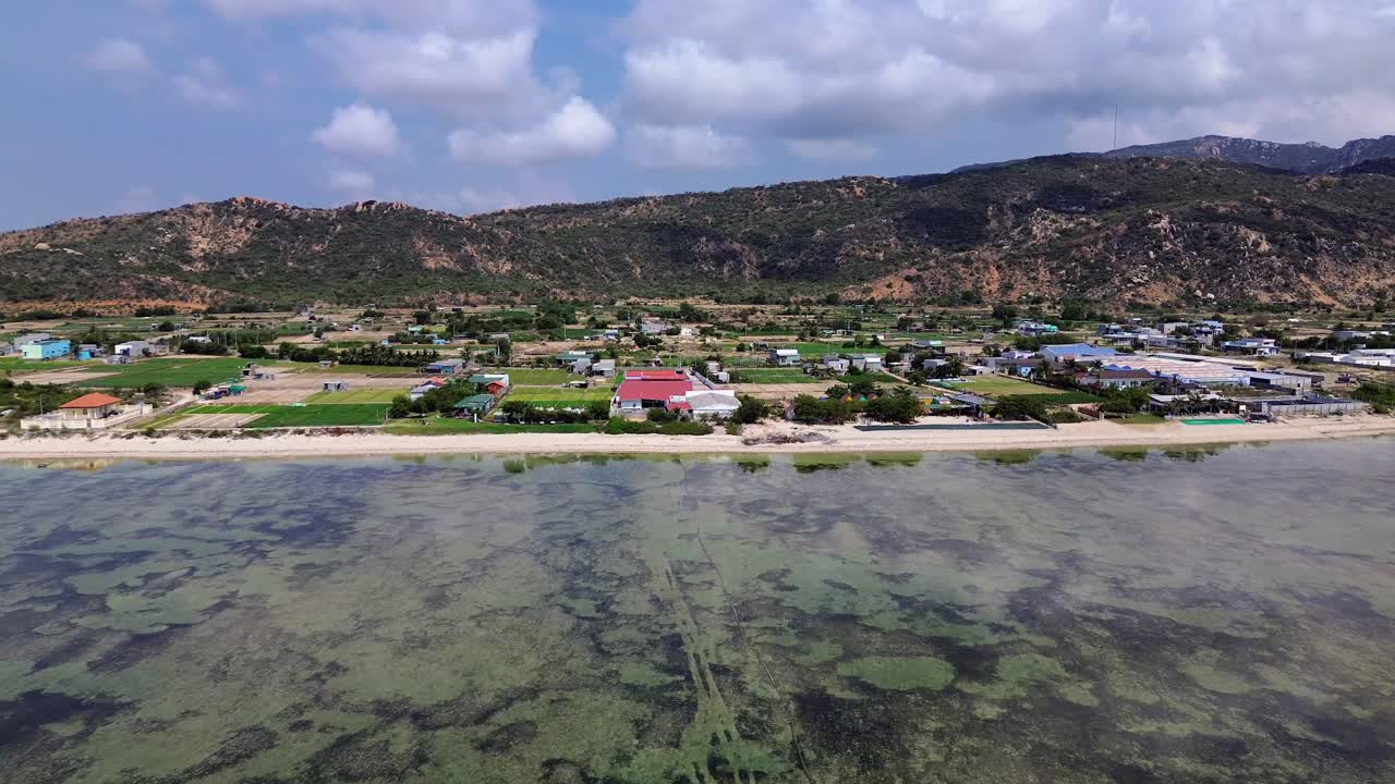 Beautiful aerial drone footage of My Hoa Lagoon with calm waters and lush tropical surroundings in Vietnam, perfect for travel and nature themes