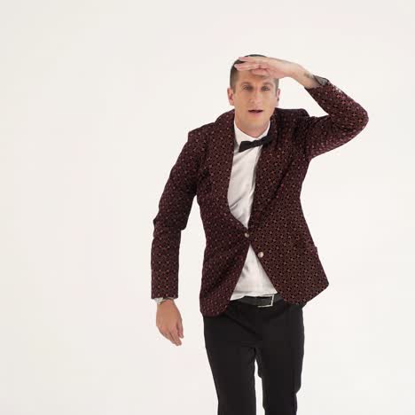 charismatic man in a brown suit is showing a typical golf player on the field. parody in the studio