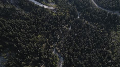 stationary panning up shot looking down the mouth of little cottonwood canyon during sunset