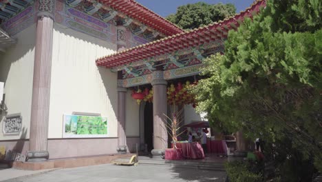 beautiful chinese lanterns hanging at the entrance hall of kek lok si temple in penang, malaysia on a sunny day - panoramic shot