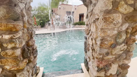 beautiful swimming pool waterfalls, tilt-up shot