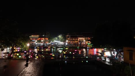 view over hoian high season holiday at night, lantern boat on river, time-lapse