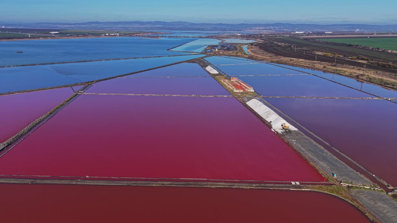 Salt flats in bright colors reveal landscape and water features
