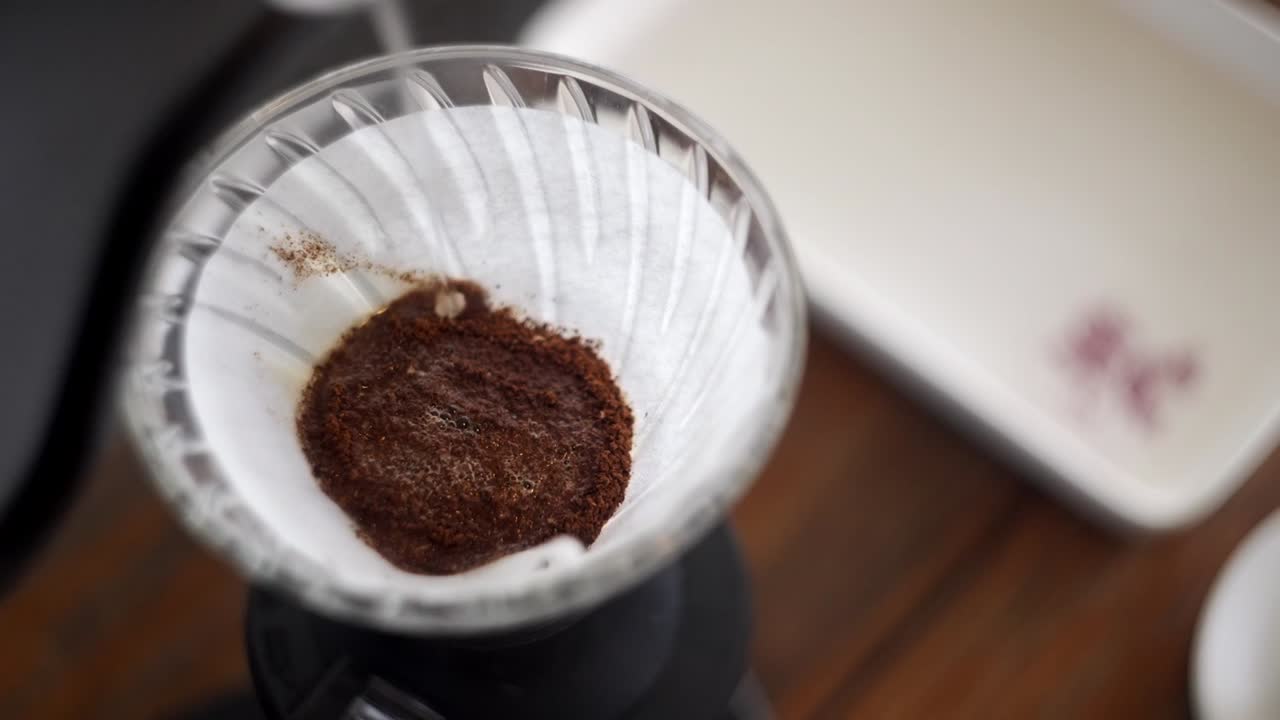 Close up of Hot water served in a paper filter for specialty coffee prepared in V60 method.
