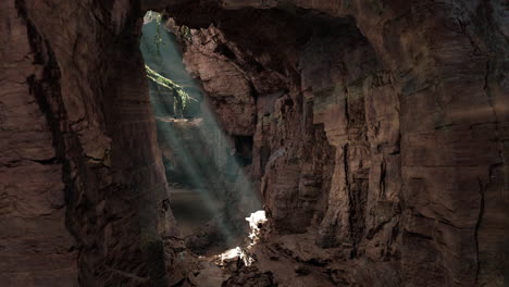 sunlight streaming into a deep cave