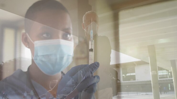 Animation of female doctor with covid 19 vaccine over senior man wearing face mask