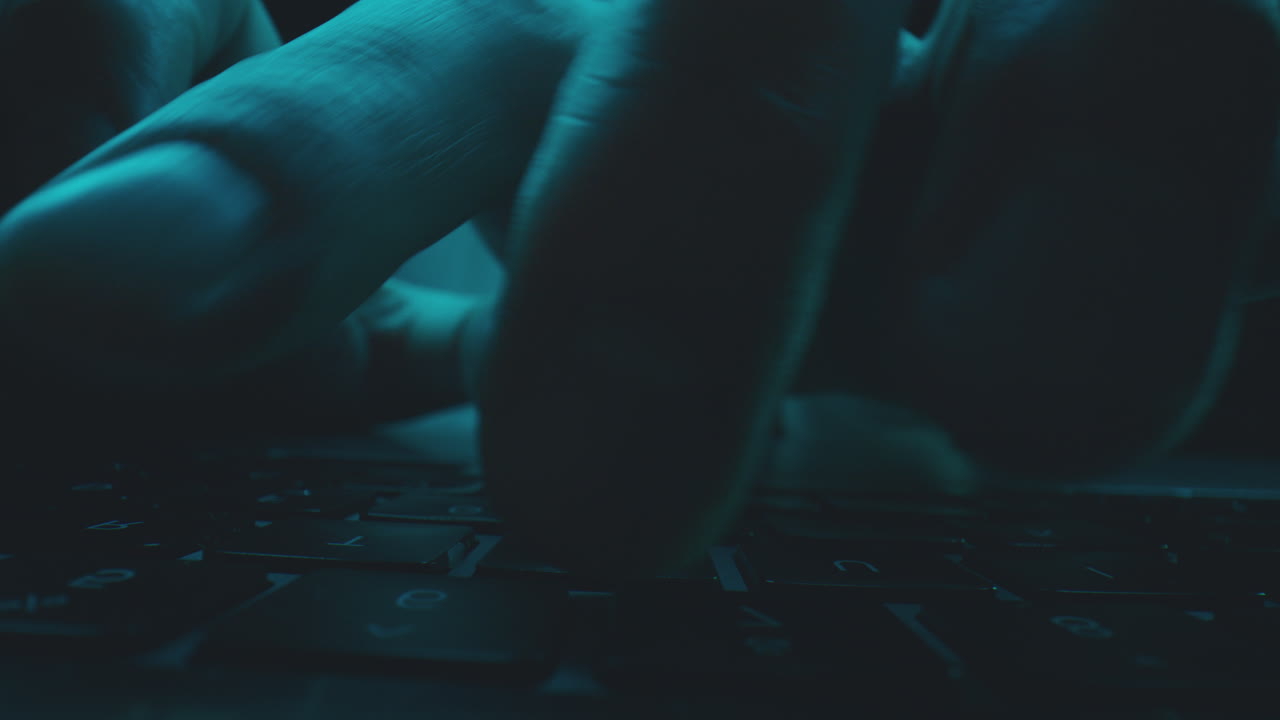 Person Typing on a Laptop