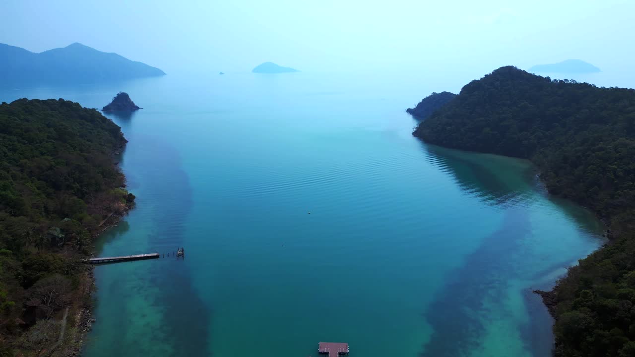 Scenic aerial view of lush green hills and turquoise waters on Koh Chang Ngam Island. Dramatic aerial view flight speed ramp hyper motion time lapse
