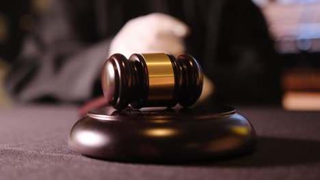 a judge striking a gavel symbolizes crucial decisionmaking and authority within the courtroom setting