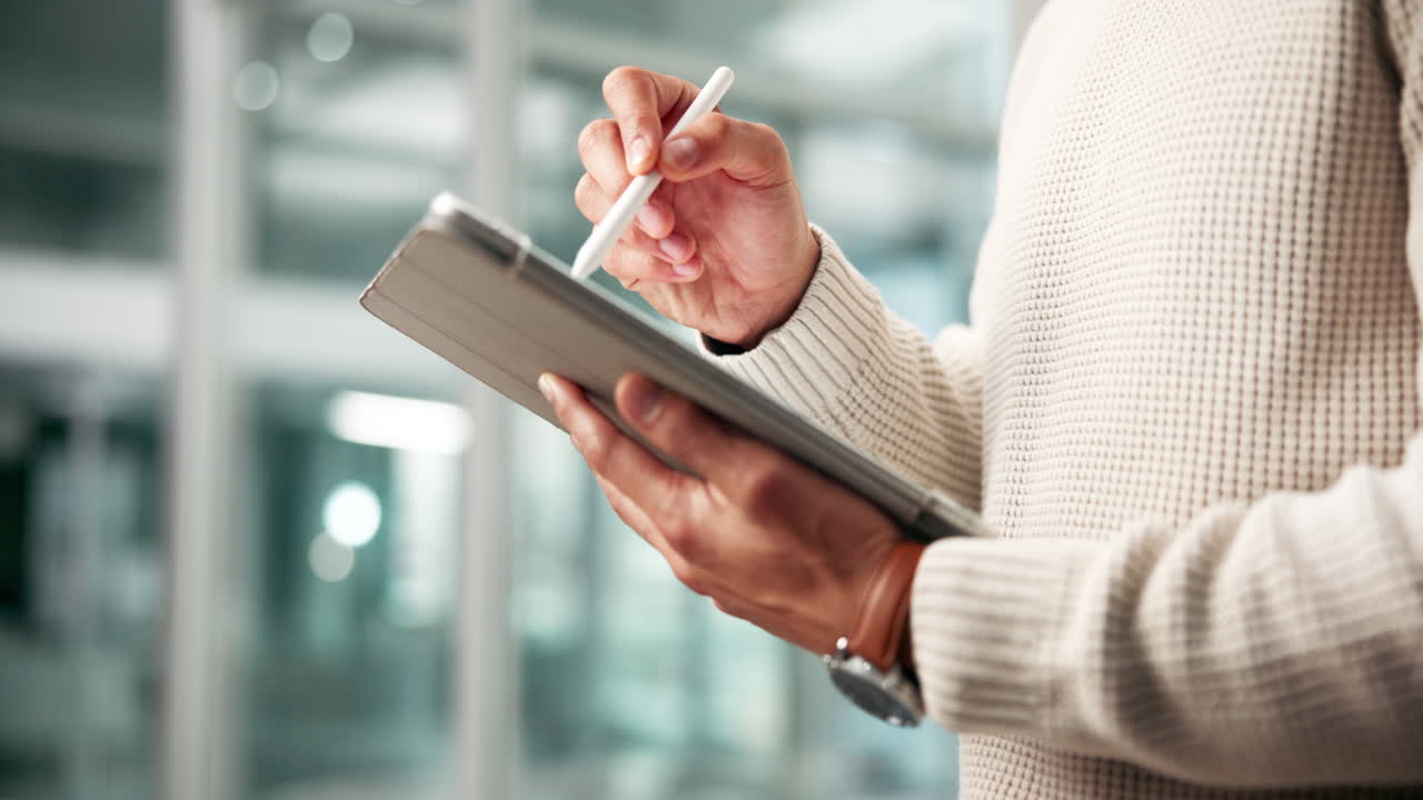Man using a tablet with a stylus