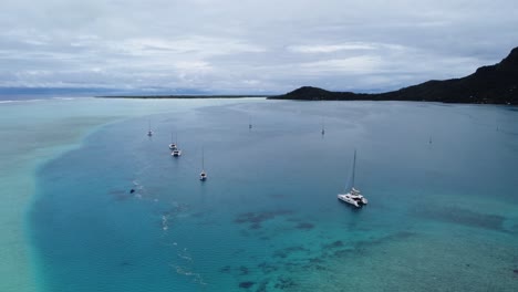 Aerial-rise-over-shallow-blue-lagoon-in-south-Pacific-French-Polynesia